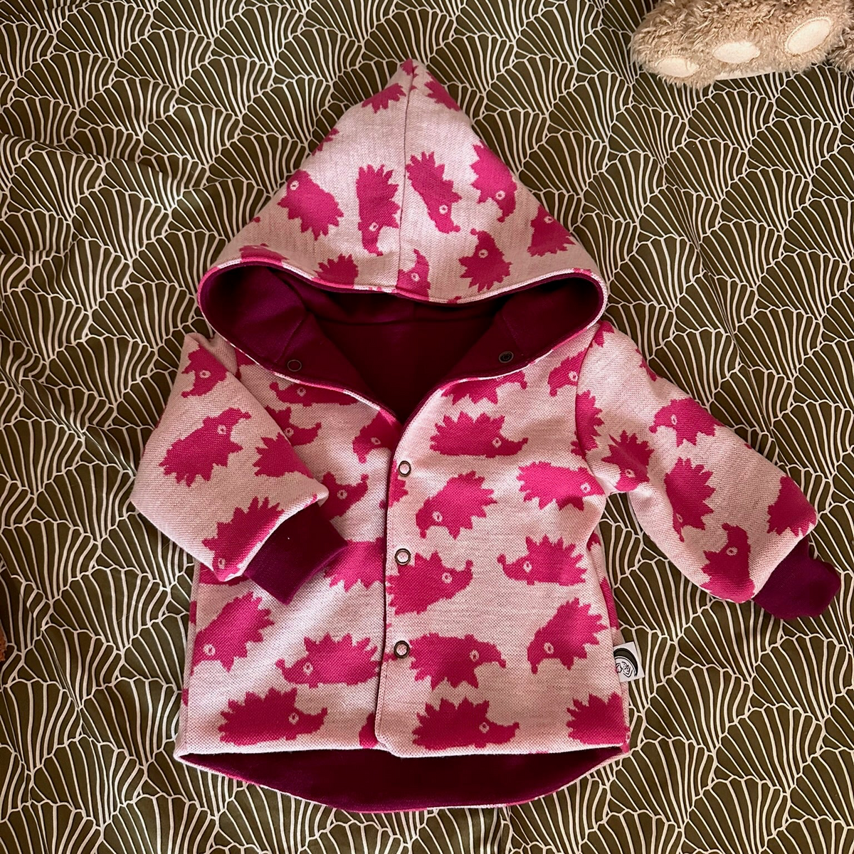 Omkeerbaar babyjasje merinowol Orchid