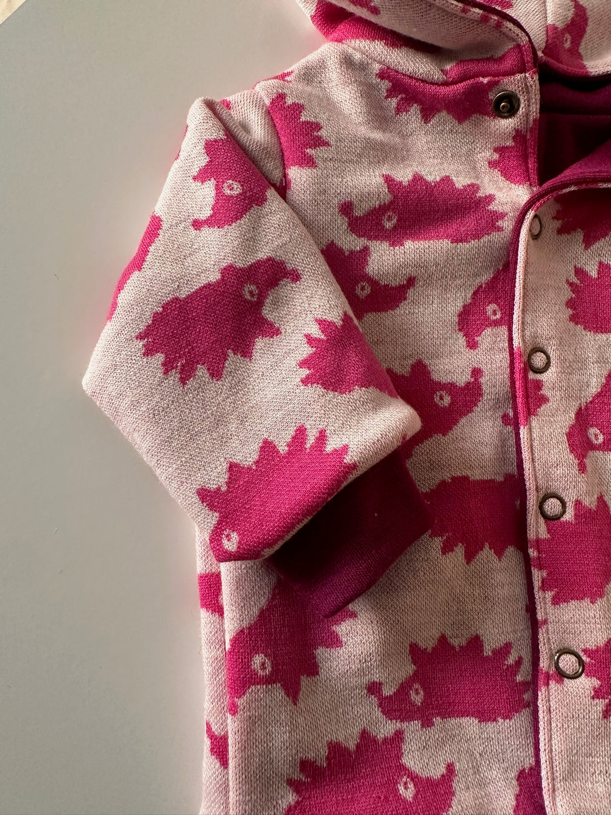 Omkeerbaar babyjasje merinowol Orchid